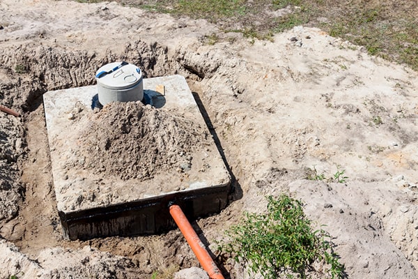 signs that your septic tank needs pumping include slow draining sinks and toilets, foul odors, and pooling water in the yard